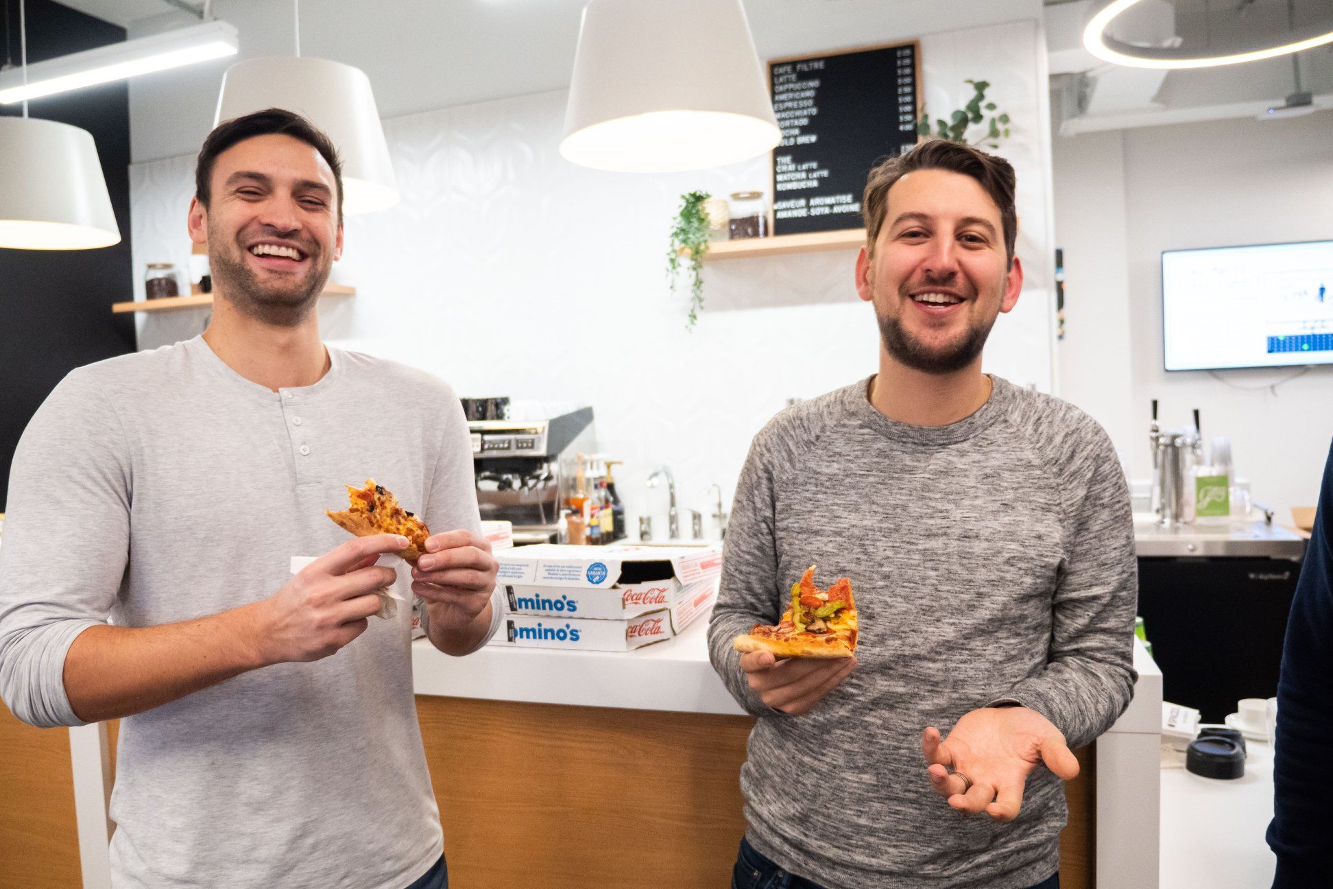 Me eating pizza with Lighthouse Labs' CEO Jeremy Shaki